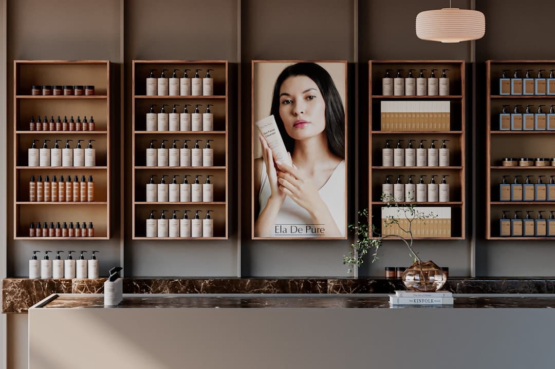 A modern skincare boutique showcasing Ela De Pure products arranged neatly on wooden shelves. The space exudes elegance with its warm wood textures, marble details, and serene minimalist ambiance.
