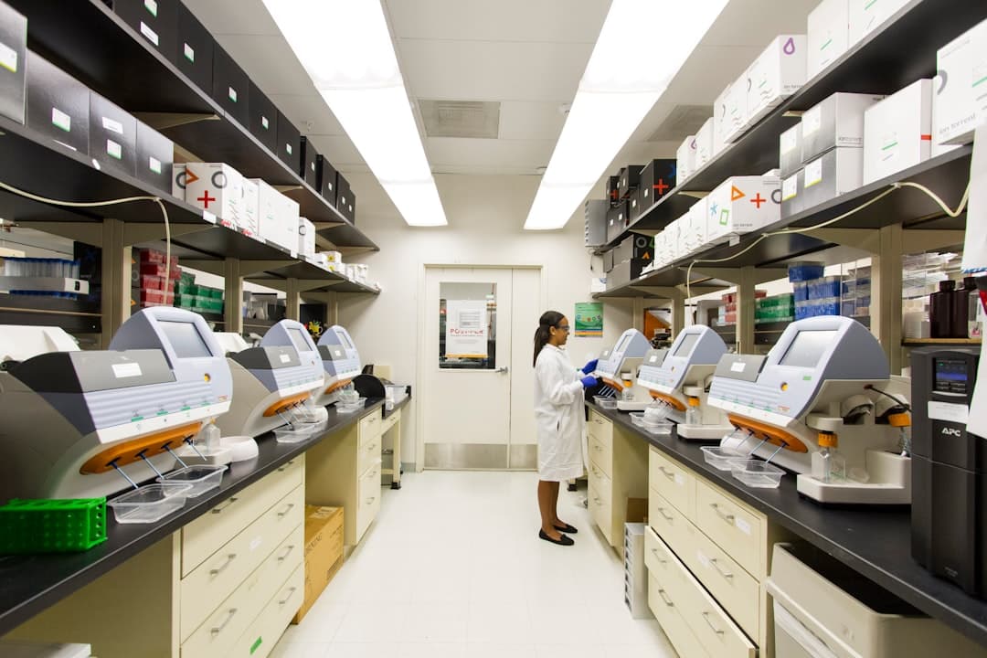 DNA Genotyping and Sequencing. A technician works among a fleet of desktop genomic sequencing machines at the Cancer Genomics Research Laboratory, part of the National Cancer Institute's Division of Cancer Epidemiology and Genetics (DCEG).