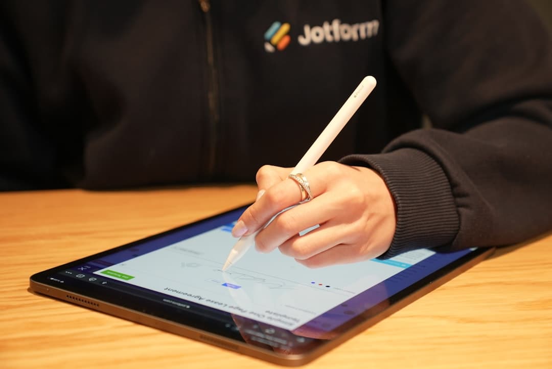 A woman signing a contract using electronic signature